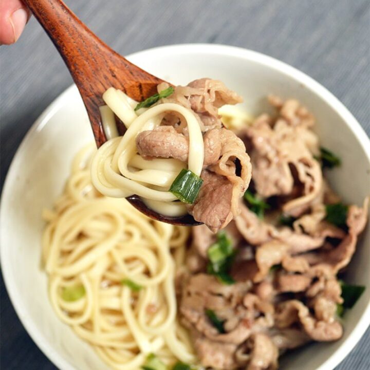 japanese udon with dashi broth and stir fried thin sliced beef