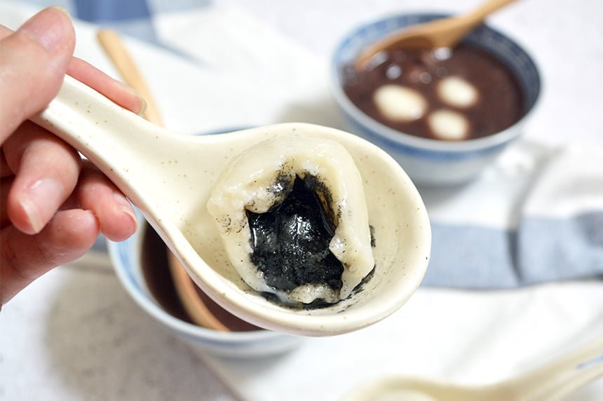 chinese glutinous rice balls with black sesame paste filling oozing out
