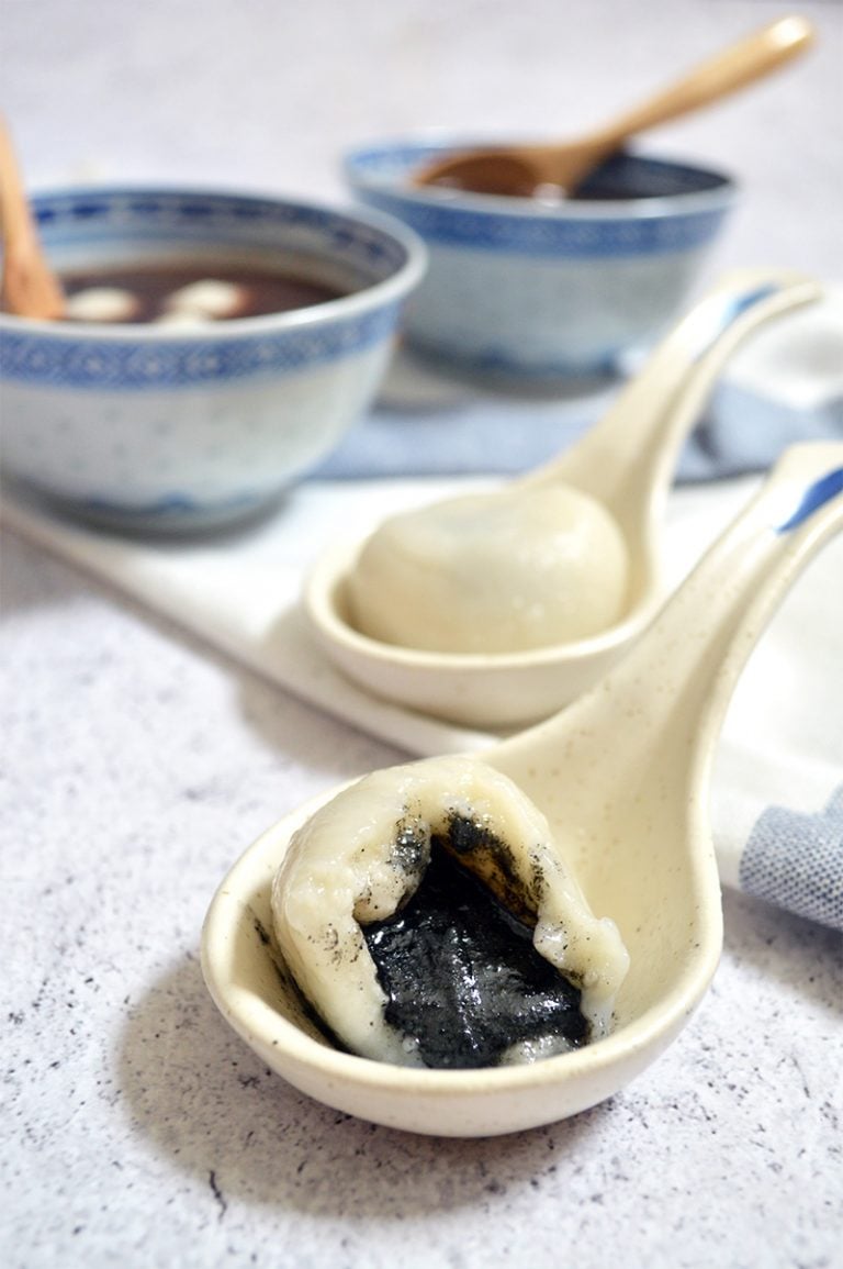 chinese glutinous rice balls with black sesame paste filling oozing out