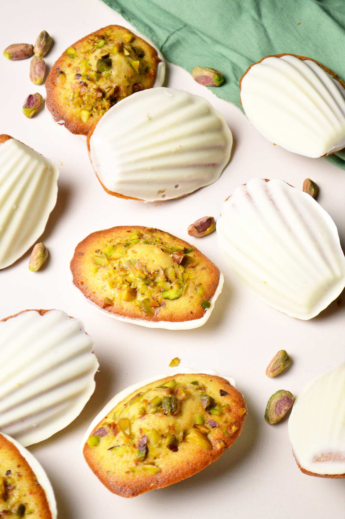 pistachio madeleines made with freshly grounded roasted pistachios and coated with white chocolate shell