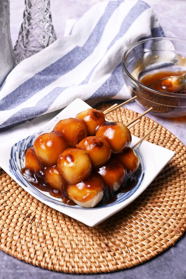 tofu mitarashi dango made with grilled tofu and sweet rice flour ball skewers and drizzled with sweet soy sauce glaze