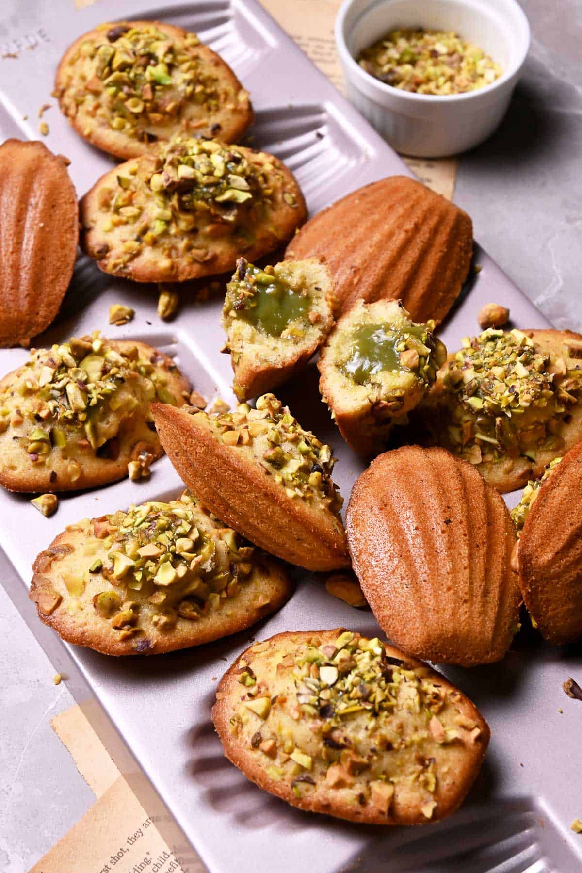 pistachio madeleines with pistachio white chocolate ganache filling