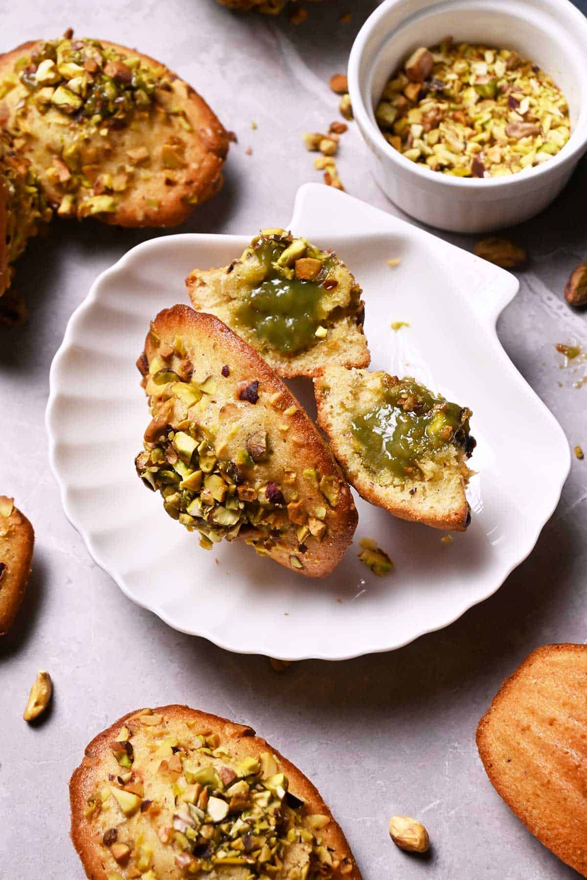pistachio madeleines with pistachio white chocolate ganache filling